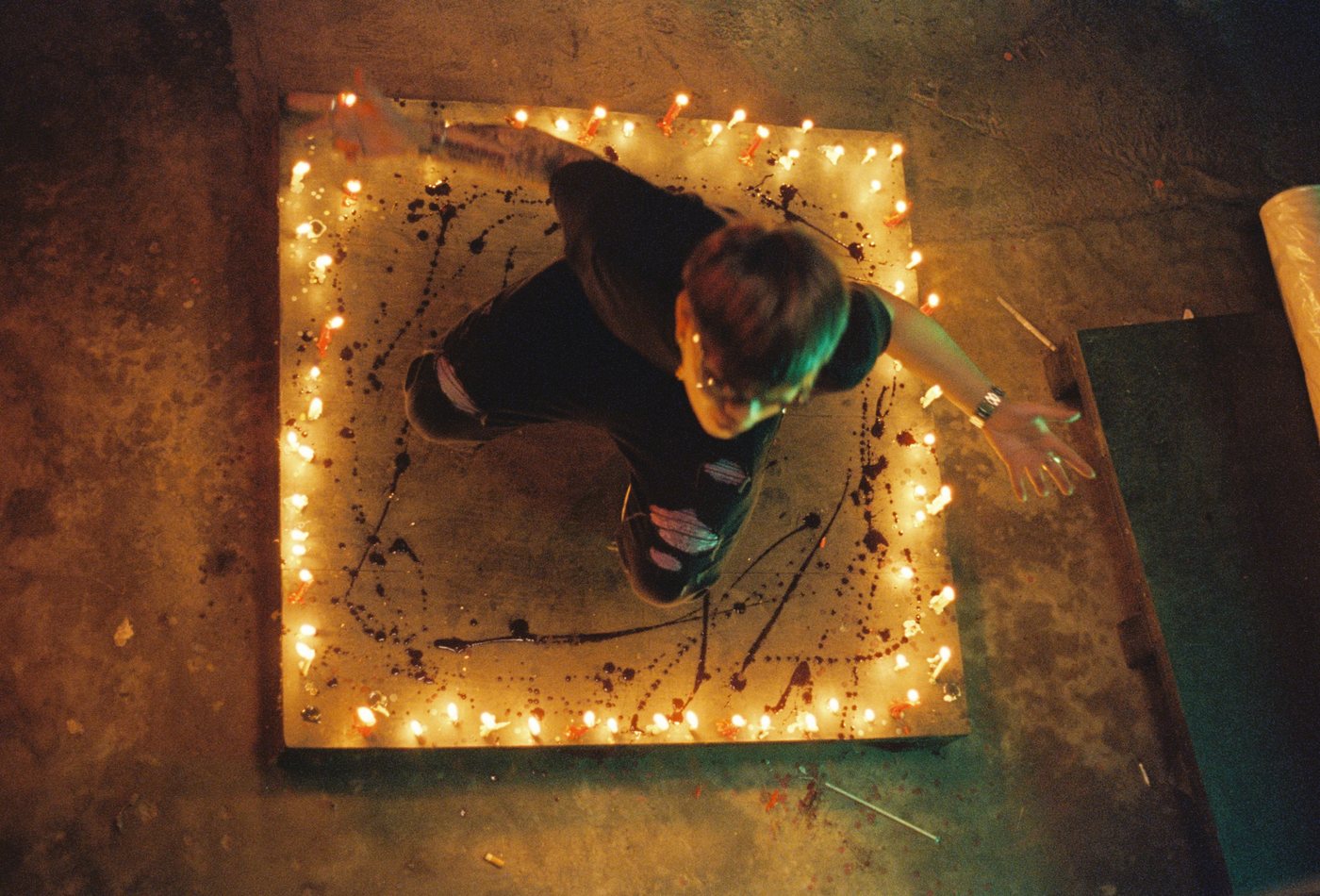 A set lit with string lights, shot from above